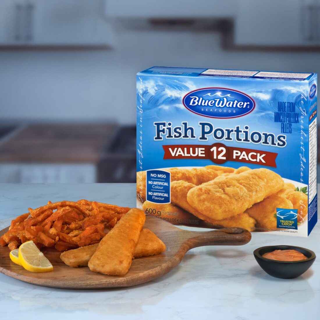 Board of VP Fish Portions and fries presented next to packaging