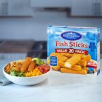 Bowl of VP Fish Sticks presented next to packaging