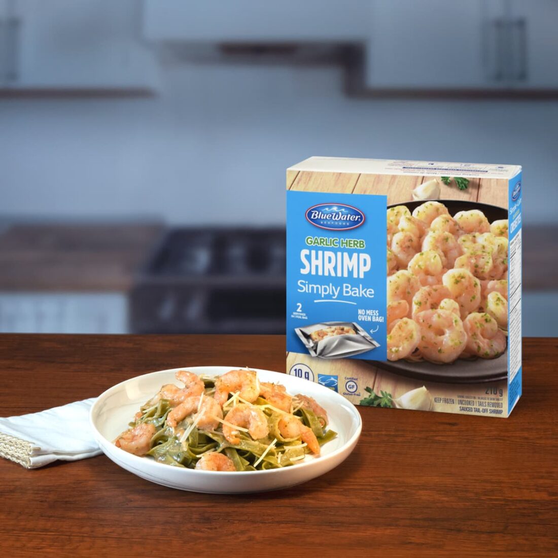 Plate of Garlic Herb Simply Bake Shrimp presented next to packaging