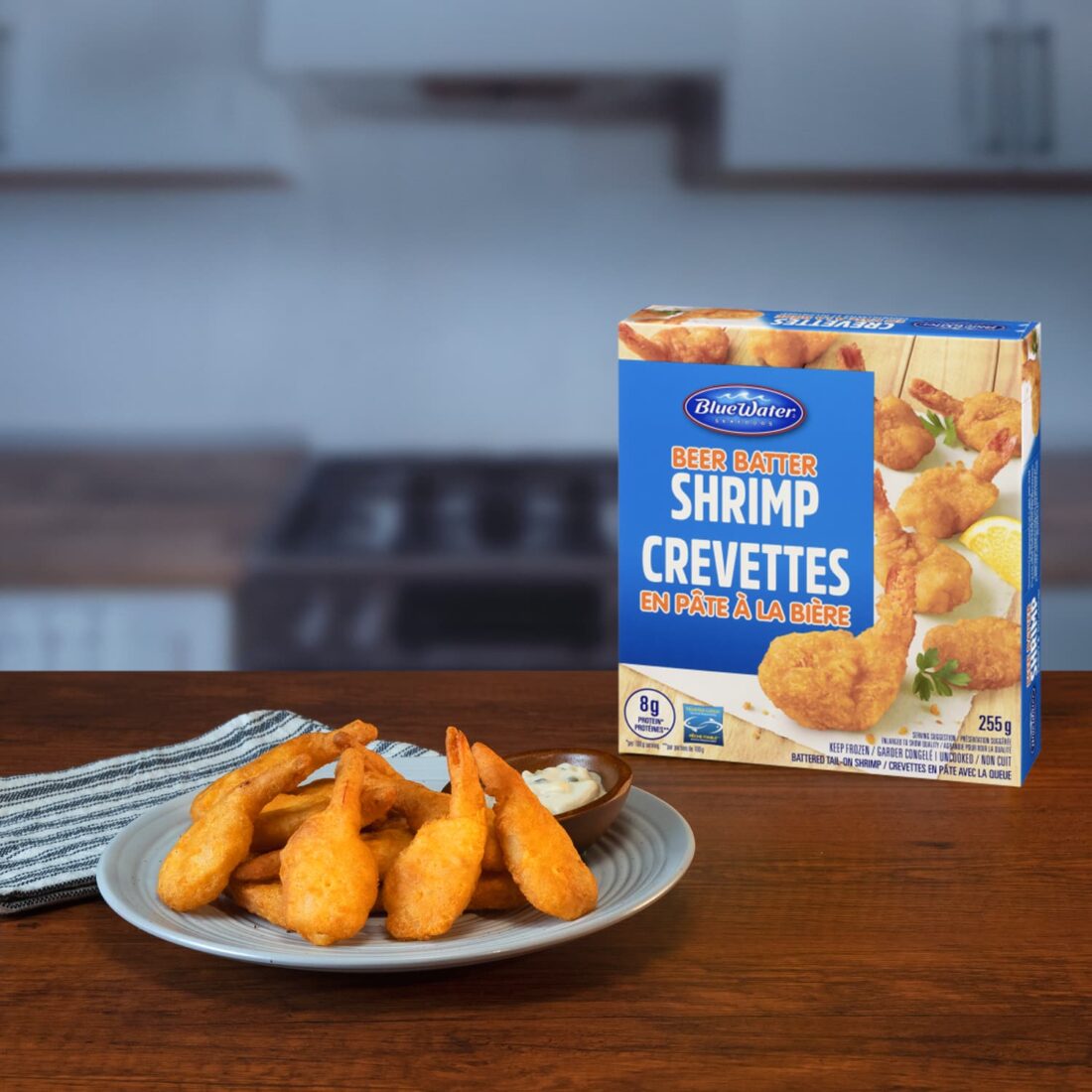 Plate of Beer Batter Shrimp presented next to packaging