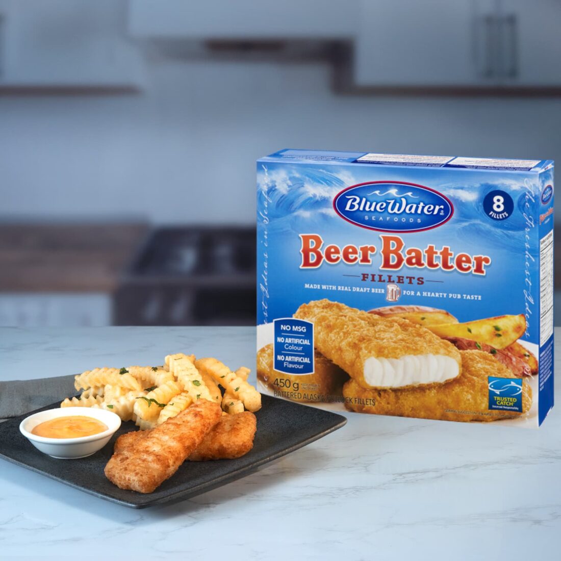 Plate of Beer Batter Fish Fillets and fries presented next to packaging