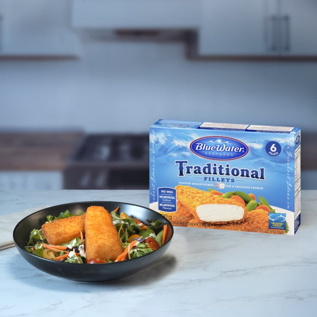 Bowl of Traditional Fillets over a bed of lettuce presented next to packaging